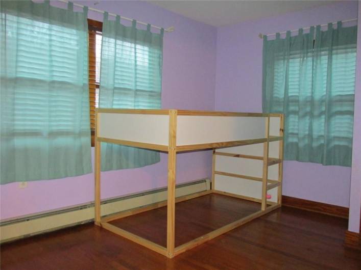 Second main floor bedroom also has beautiful hardwood floors...