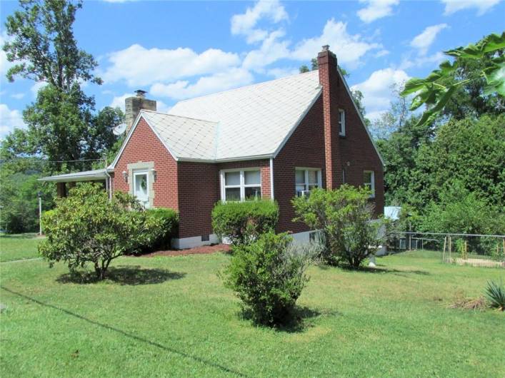 The right side of the yard has a fenced-in area which is perfect for little ones or pets...