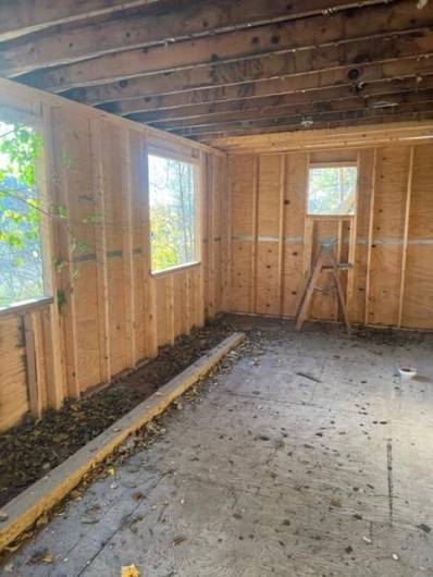 all new plywood addition - new windows on site waiting to be put in.