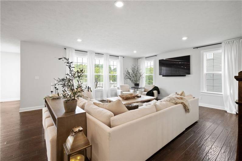 Large and open Family Room anchored by walls of windows.