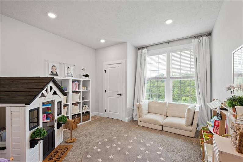 Main floor bedroom currently used as a Playroom.