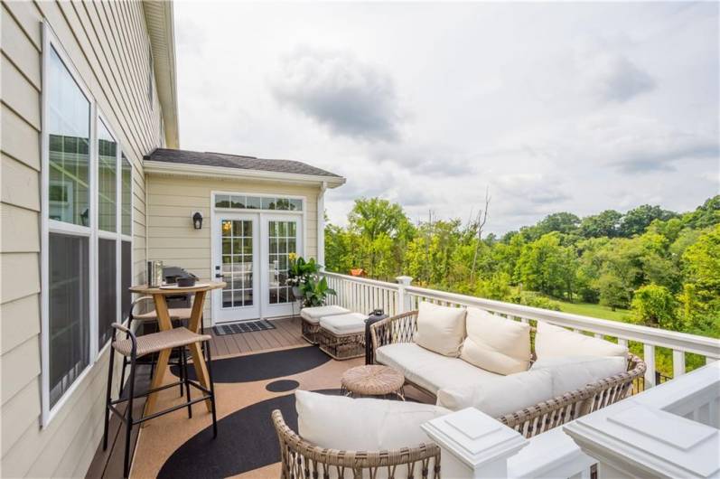 Composite deck off of the Morning Room with private, wooded views.