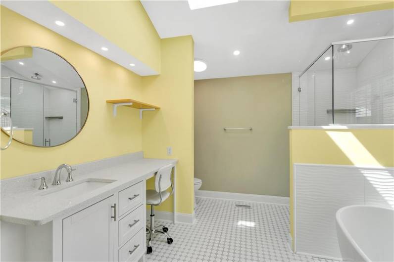 Plenty of vanity space in this master with classic floor tile.