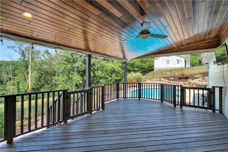 Beautiful wood ceiling and fan on this large deck.