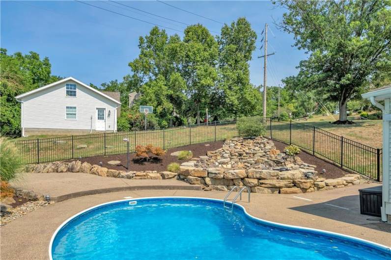 Fantastic water feature adds to your relaxation  time in this backyard!