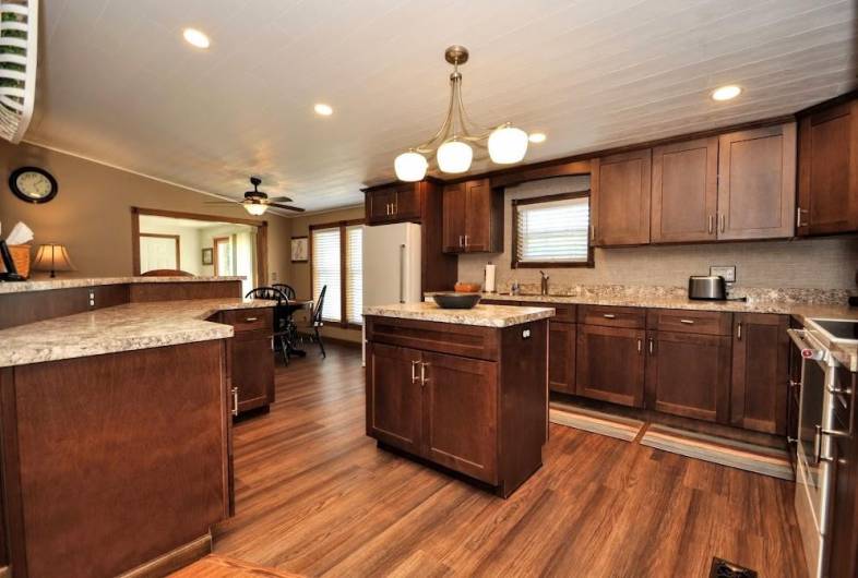 Brand new maple kitchen with vangura countertops.  Soo many countertops for those amazing parties. Can you just see those trays of food when you have gatherings.