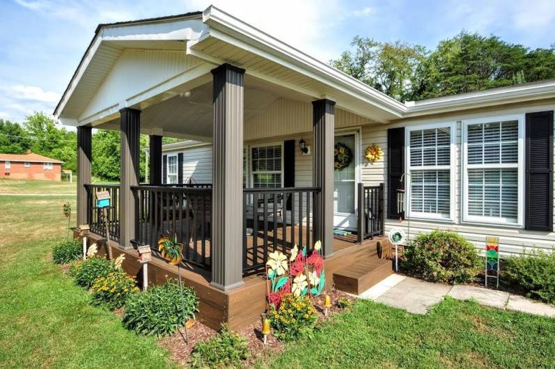 Take a stroll up the sidewalk to the covered front porch