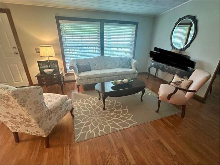 Come on in the livingroom and set awhile. The interior has newly painted walls, laminate floors.  Just bring in the furniture.