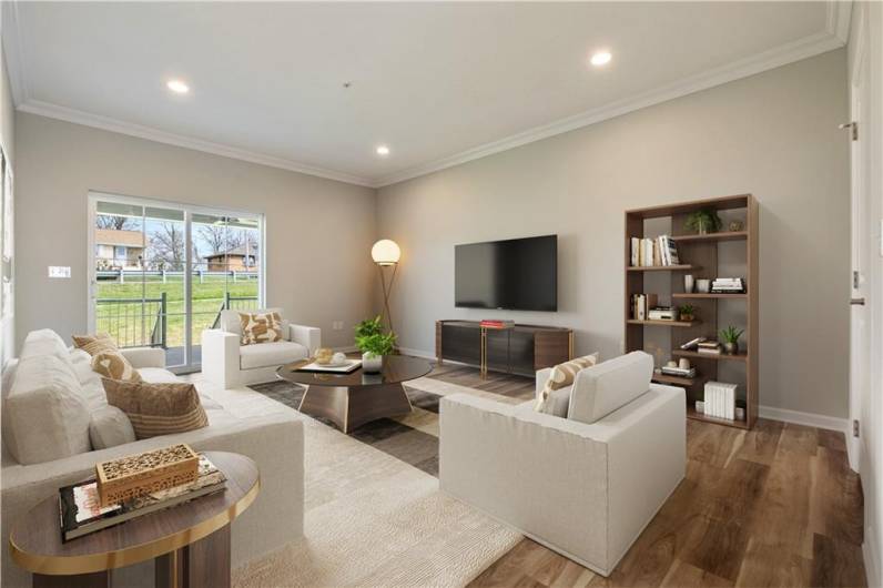 The living room is a cozy space that looks onto the deck