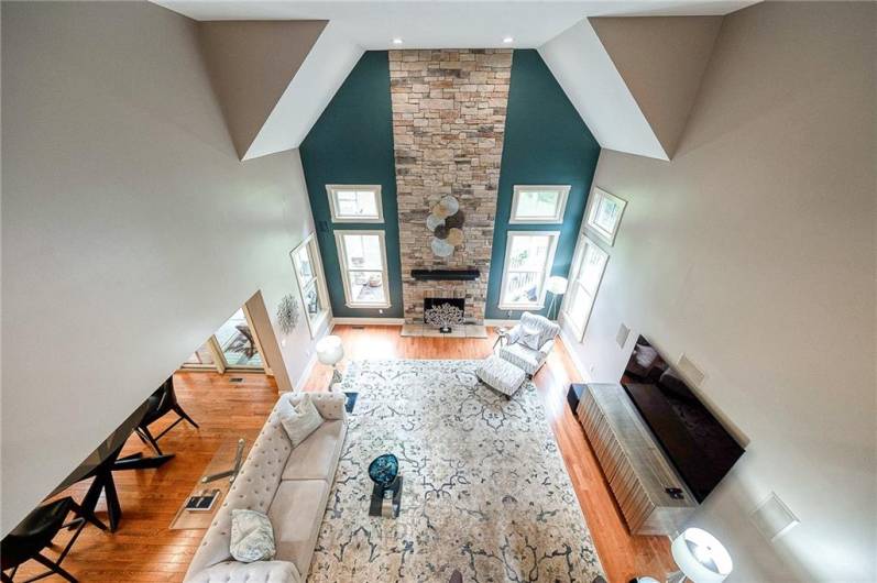 Great Room - Stunning great room. The soaring ceiling and stone fireplace that truly steals the show!