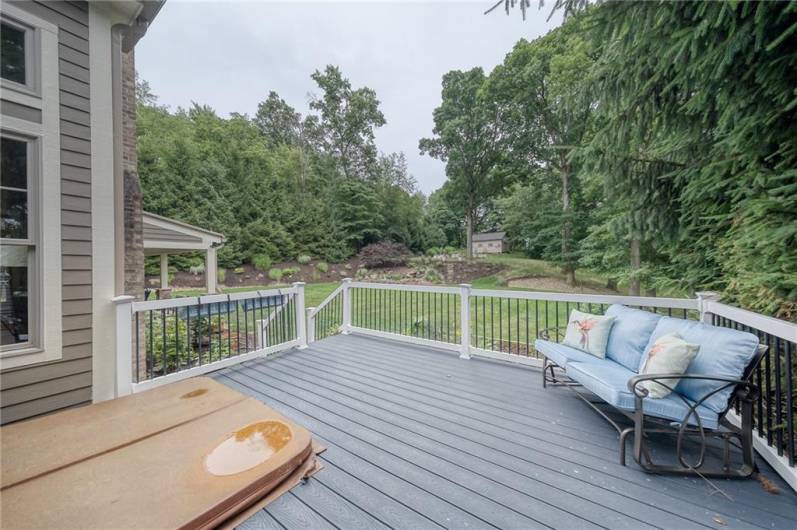 Deck off primary suite with built in hot tub