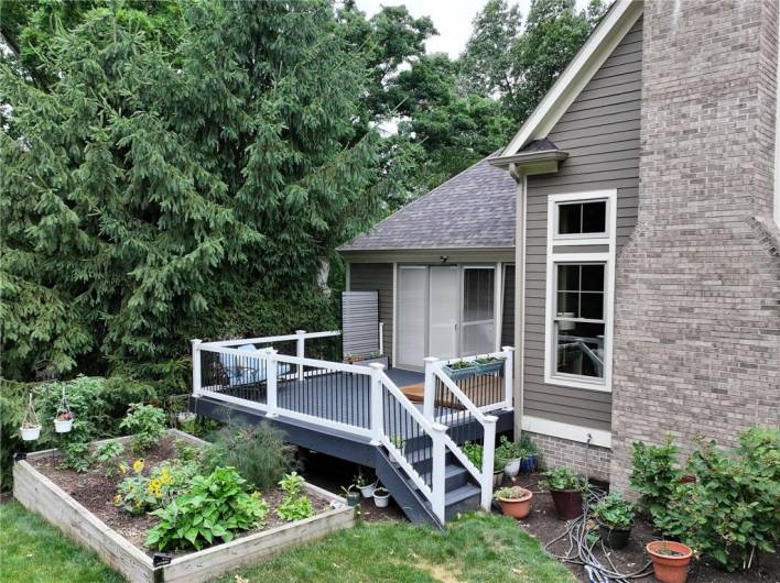 Deck off primary suite with built in hot tub