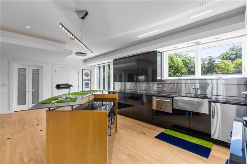 A second kitchen/prep area with all amenities in the workout/famly room/home theater area.