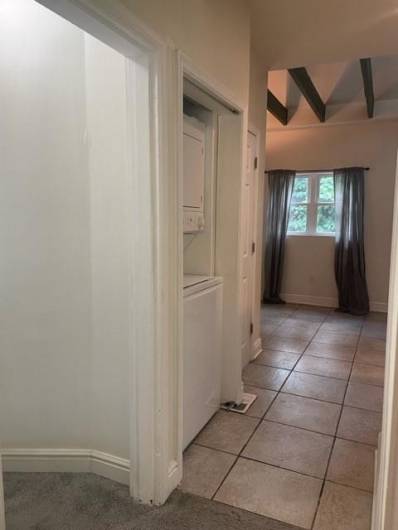 Washing and dryer is included and conveniently located in the hallway outside of the main floor bathroom and off the kitchen area.