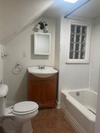 Full bathroom off of lower level bedroom.