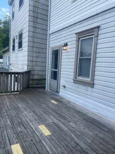 Outdoor deck before the owner stained and sealed it.