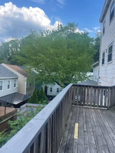 A view from the deck overlooks a quiet area in the back of the homes located on this street and the street right before Edwards Way.