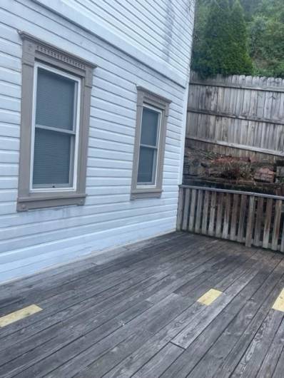 The deck was repaired and then sealed & stained after this photo was taken.