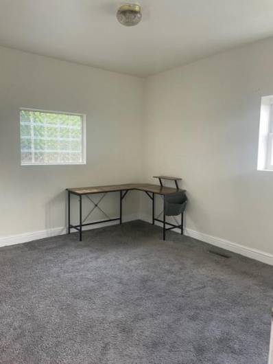 Main floor flex space that has been used as a bedroom or living room.