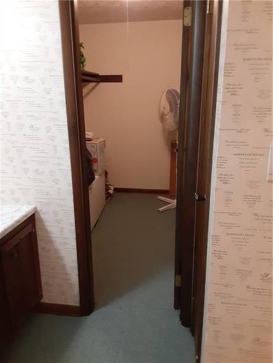 Large office's walk in closet off of bathroom