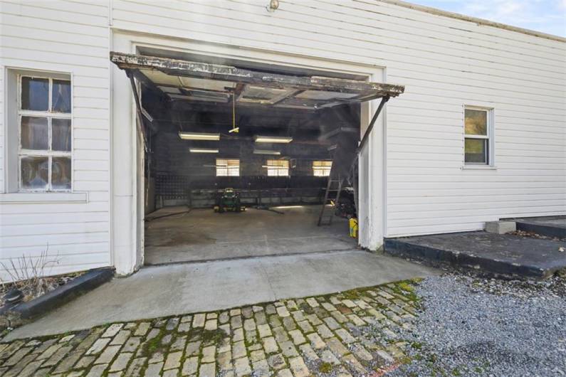Looking into the garage of the main building from outside the open garage door.