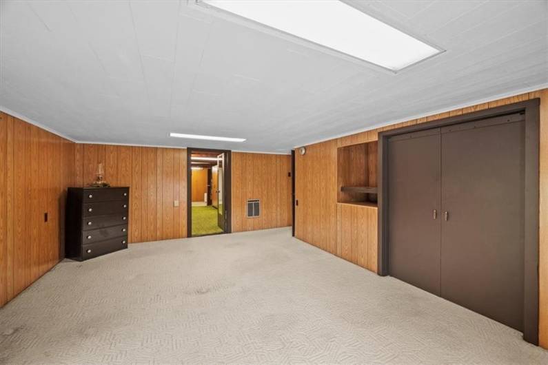 Alternate view of bedroom 2. The door at the far end leads to a dressing/storage space.
