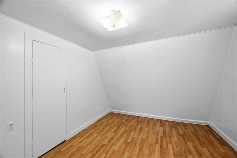 This bedroom is situated off of the kitchen in the small house. Iti is 9.5'x8'. New vinyl flooring has just been installed.