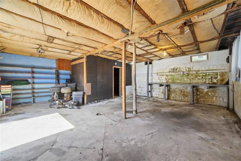 The garage for the small house is 22'x17'. The well room can be seen in the far right corner.