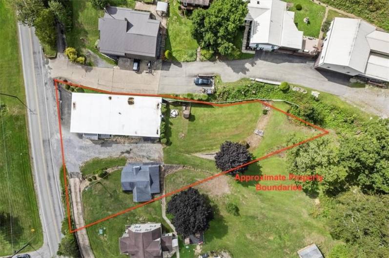 Aerial View of both buildings on the property with approximate property boundary lines.
