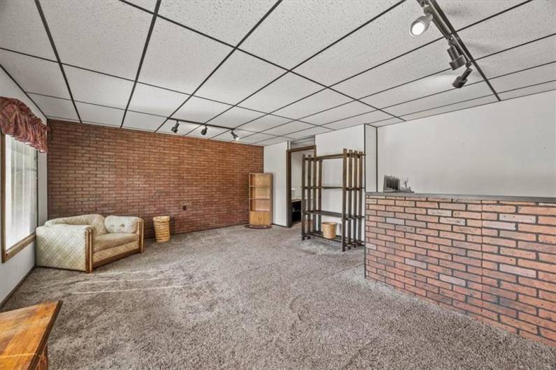Enter the lower level commercial space into a front reception area and/or front office that is 21x17'.