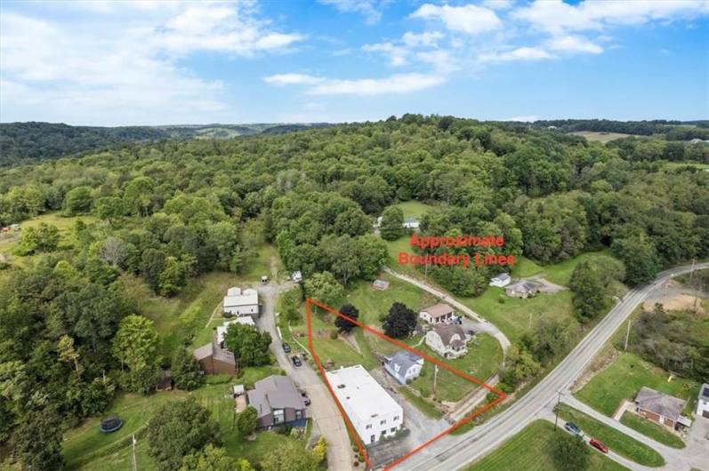 Aerial view of both buildings on the property with approximate boundary lines.