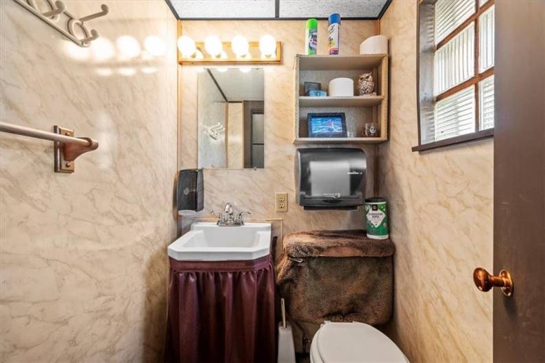 Half bath in lower level commercial space.
