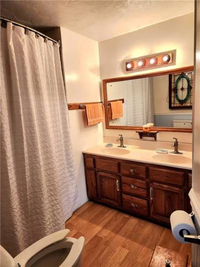 Bathroom has a laundry chute leading to the Lower Level.