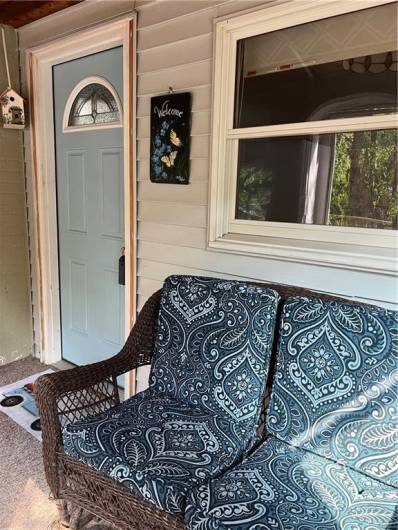 Covered and enclosed porch.
