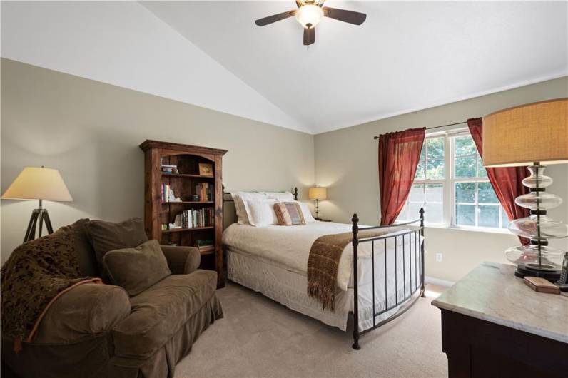 The vaulted ceiling makes this sizable bedroom feel grand!