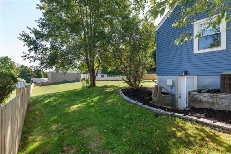 Simple landscaping surrounds the home keeping maintenance to a minimum.