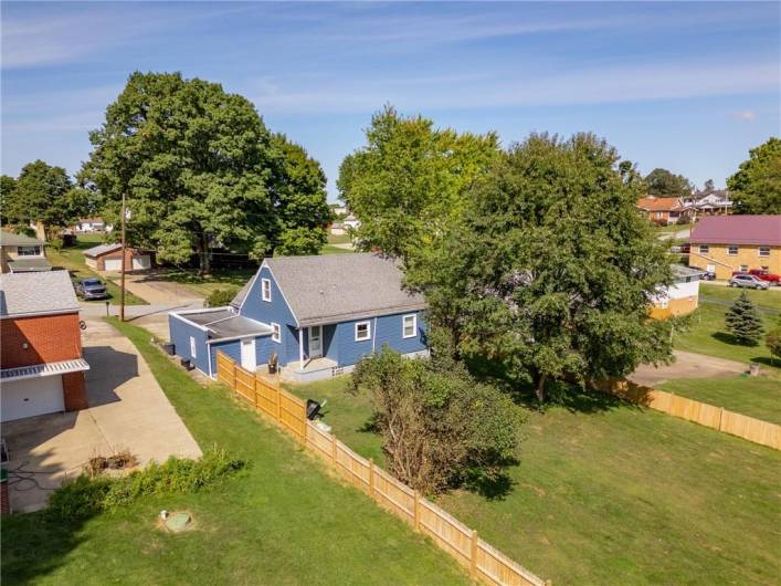 The fenced-in backyard offers an outdoor play oasis!