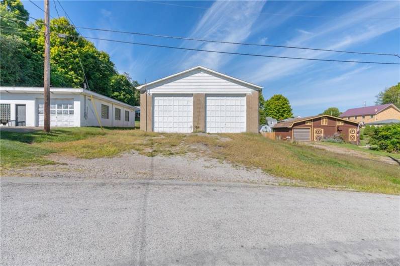 Access the detached, two-car garage from Carries drive. Between the driveway out front and the parking area out here, you'll have plenty of room for all the fiesta guests!