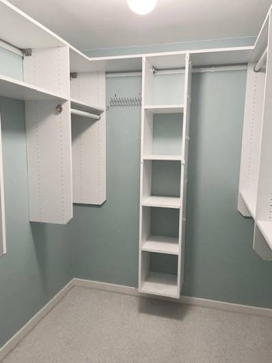 Walk-in closet in primary bedroom.