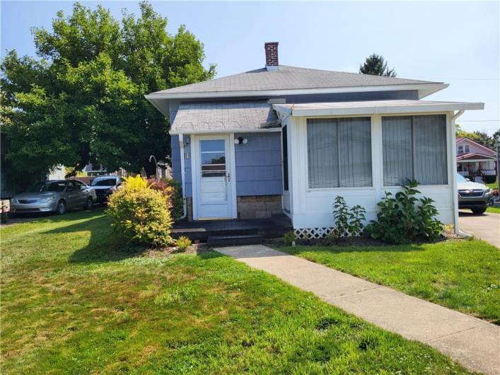 Back of the house and 3-season room...Thanks for viewing 411 Rainey Ave.