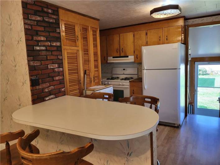 ...breakfast bar divides the kitchen from the dining room