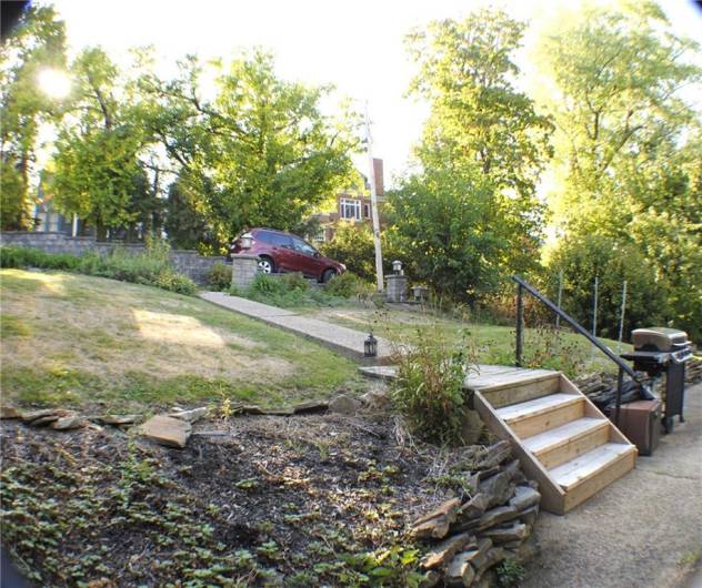 The rear yard was redone with sidewalks, steps and retaining wall in parking area.