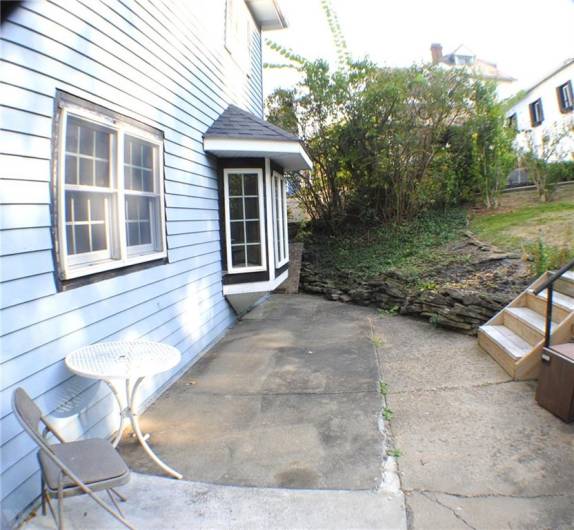 The rear yard was redone with sidewalks, steps and retaining wall in parking area.