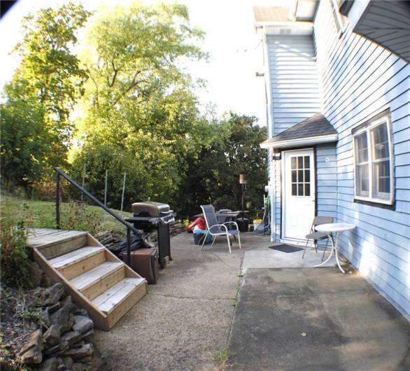 the rear yard was redone with sidewalks, steps and retaining wall in parking area.