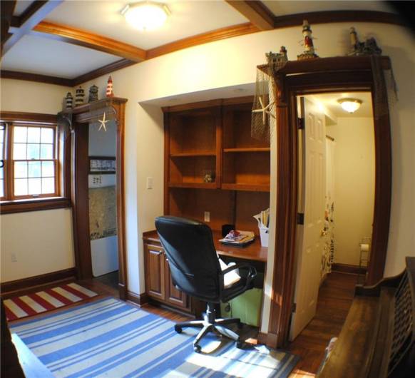 This family room is beautiful redwood with built in bookcases, window sits, newer windows, gas fireplace built in desk with shelves.  And Coffered Ceiling.