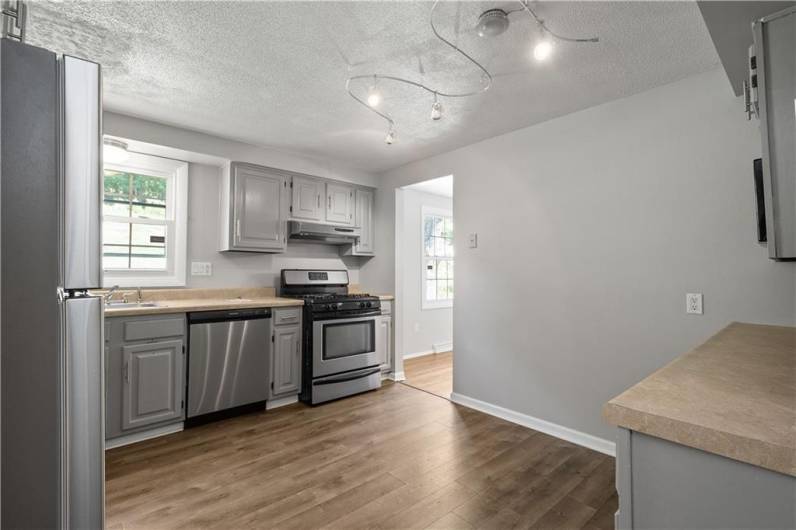 Plenty of cabinet storage and stainless steel appliances in this Kitchen.