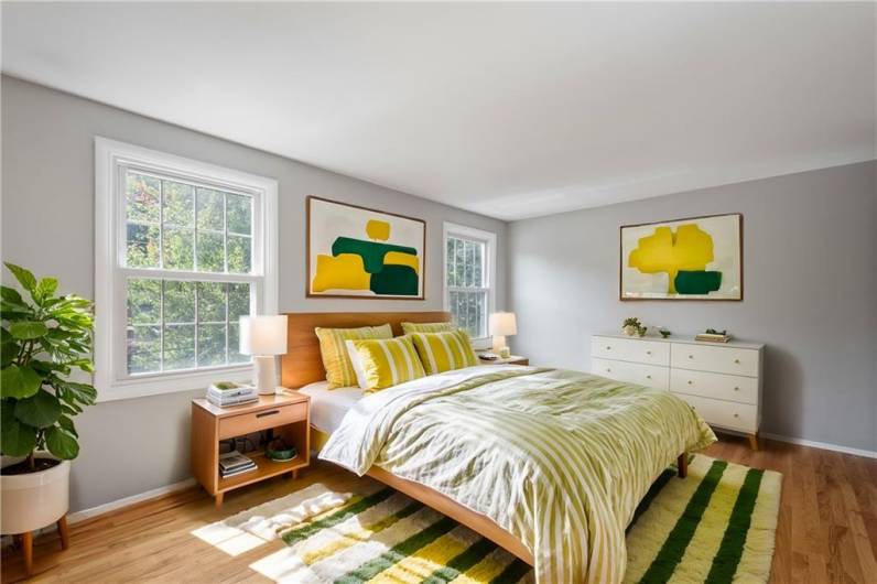 2nd Bedroom with tons of natural light and double closets. Virtually staged photo to illustrate what is possible!