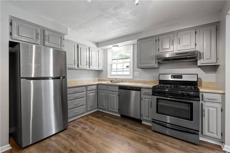 Plenty of cabinet storage and stainless steel appliances in this Kitchen.