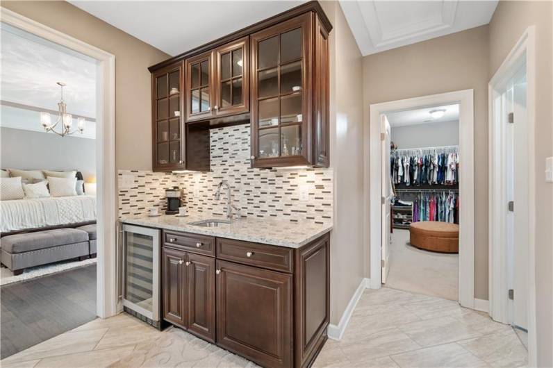 The owner's bath has this cool wet bar set up. Do you see what I see... that's 3... and don't miss the TWO walk-in closets!!