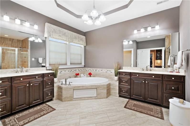 Dual vanity, soaking tub, two shower heads in the walk-in tile shower - WOW!!